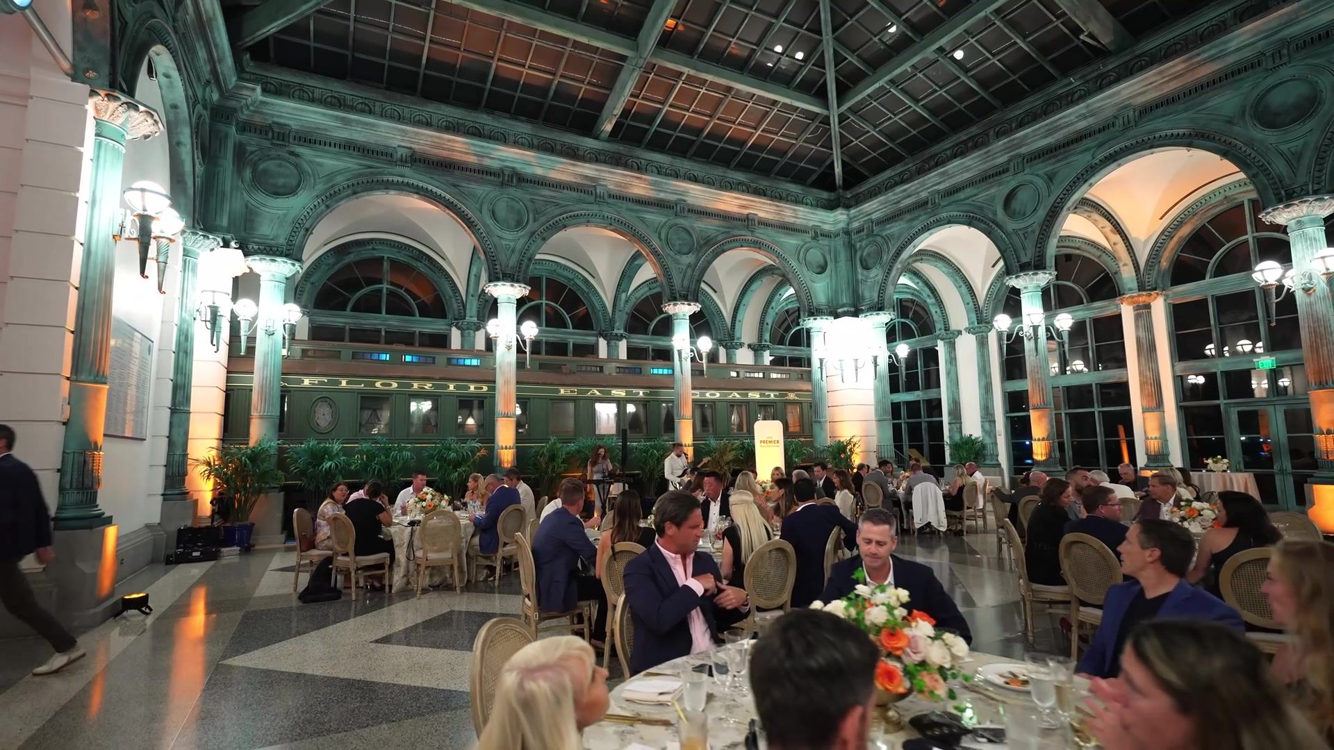 Guests at dinner under the arched glass ceiling of the Flagler Museum pavilion, Palm Beach